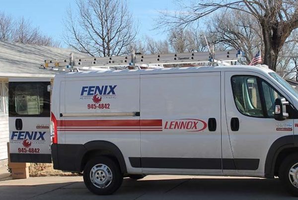 Fenix Heating & Cooling van doing installation at a fair price in Wichita neighborhood