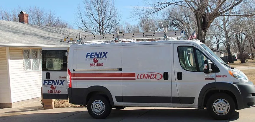 Fenix Heating & Cooling van doing installation at a fair price in Wichita neighborhood