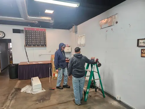 hvac-technicians-installing-indoor-mini-split-wall-unit